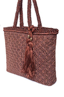 Mara Brazil Buritirana shoulder bag in brown leather with woven details, featuring a spacious design and adjustable strap.