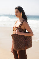 Handmade Mara Brazil Buritirana shoulder bag in natural buriti palm with leather accents, showcasing its woven texture and stylish design.