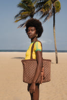 Mara Brazil Buritirana shoulder bag in brown leather with woven details, stylish accessory with adjustable strap.