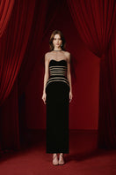Elegant JOSÉPHINE KARMA gown with flowing fabric and intricate details, perfect for formal occasions or special events.