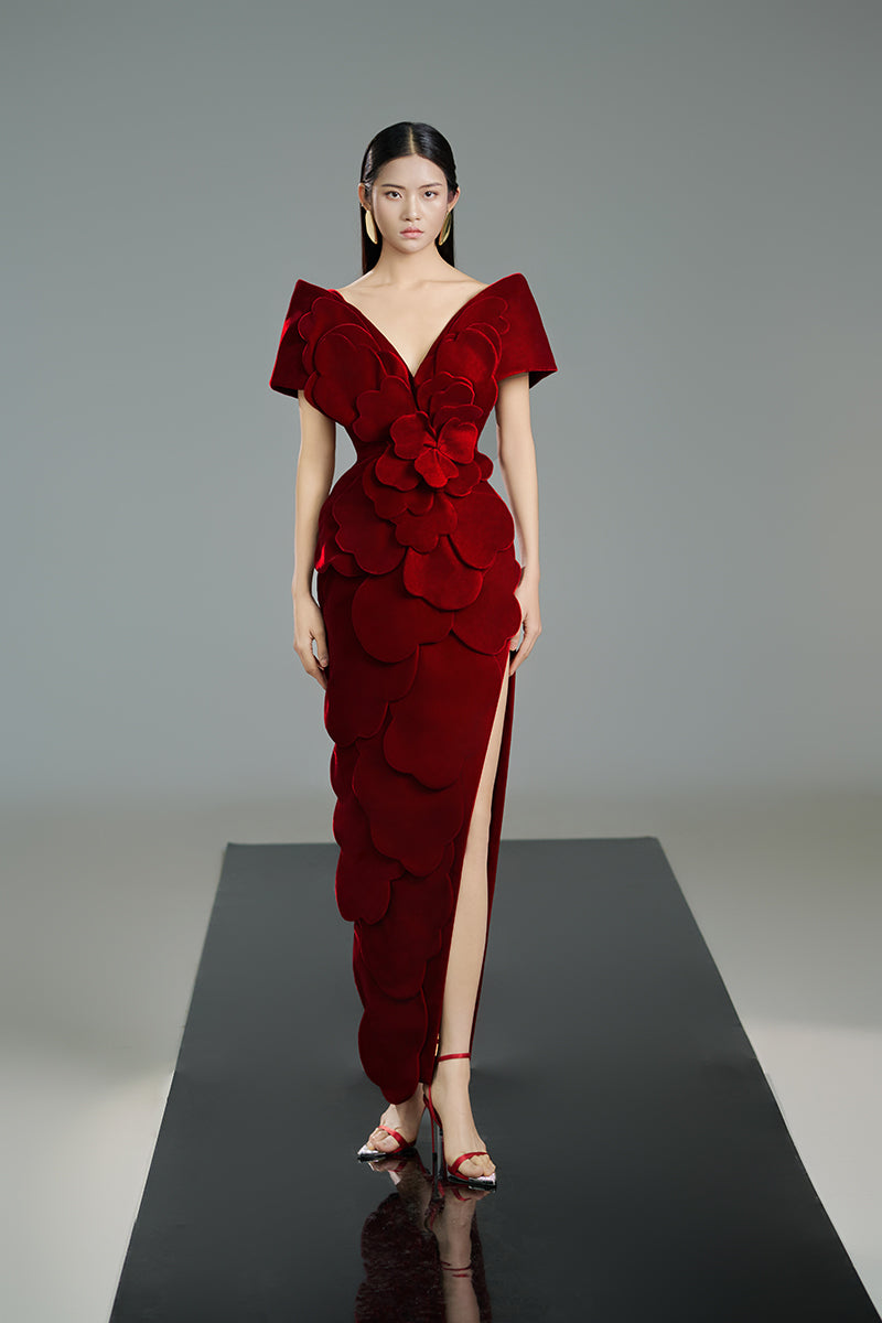 Red velvet petal-structured gown by Happy Clothing, featuring elegant draping and intricate design, perfect for formal occasions.