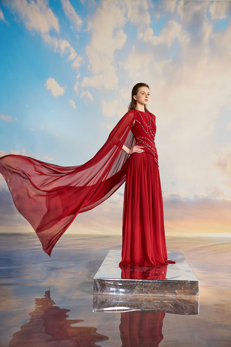 Elegant Kerenza crepe mixed chiffon pleated gown by 21Six, showcasing flowing fabric and sophisticated design.