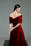 Red off-shoulder velvet gown with petal neckline and A-line silhouette from HAPPY CLOTHING, elegant evening wear.
