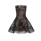 Black floral appliqué mini dress by Montsand, featuring intricate floral embroidery and a stylish mini length.