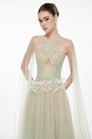Mint LYRA gown by JOSÉPHINE featuring elegant fabric and flowing design, shown on a model.