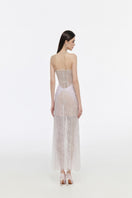 Elegant JOSÉPHINE Stella gown with flowing fabric and intricate details, perfect for formal events.
