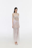 Elegant JOSÉPHINE Stella gown with flowing fabric and intricate detailing, perfect for formal occasions.