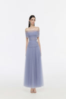 Elegant JOSÉPHINE Elise gown with flowing fabric and intricate details, perfect for formal occasions.