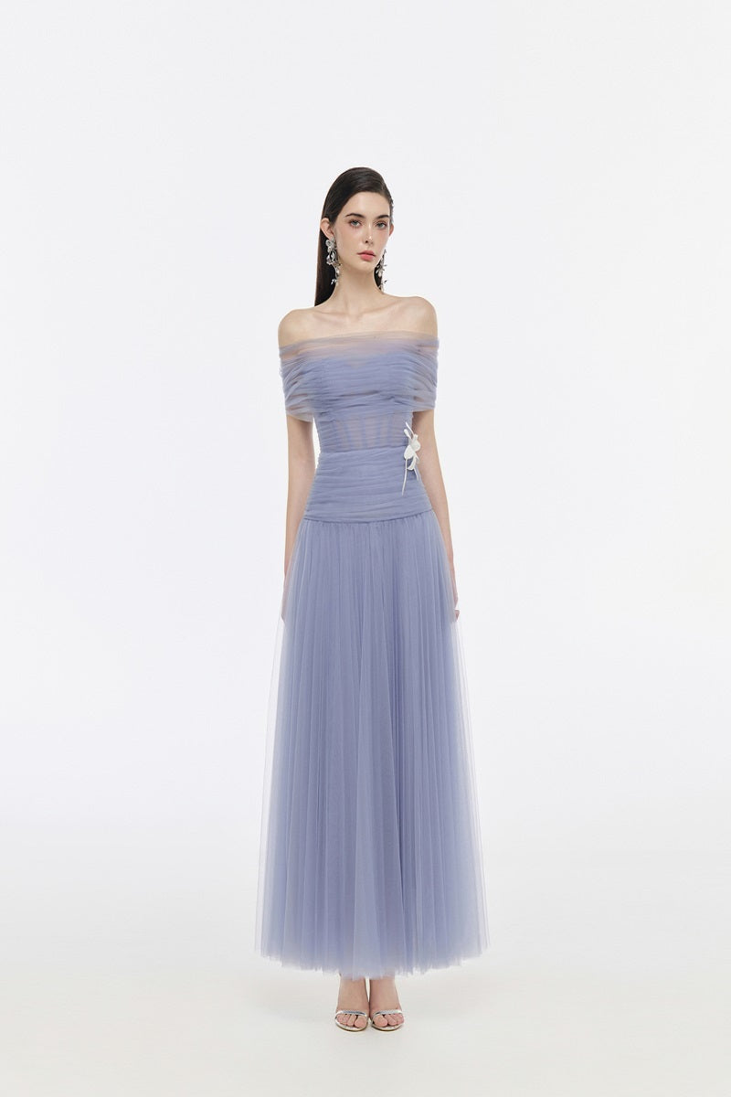 Elegant JOSÉPHINE Elise gown with flowing fabric and intricate details, perfect for formal occasions.