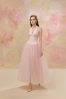 Elegant JOSÉPHINE YMIR dress gown with intricate details, flowing fabric, and a sophisticated silhouette.