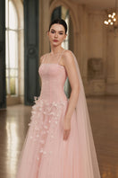 Elegant navy blue JOSÉPHINE RACHEL gown with flowing fabric and intricate detailing, perfect for formal occasions.