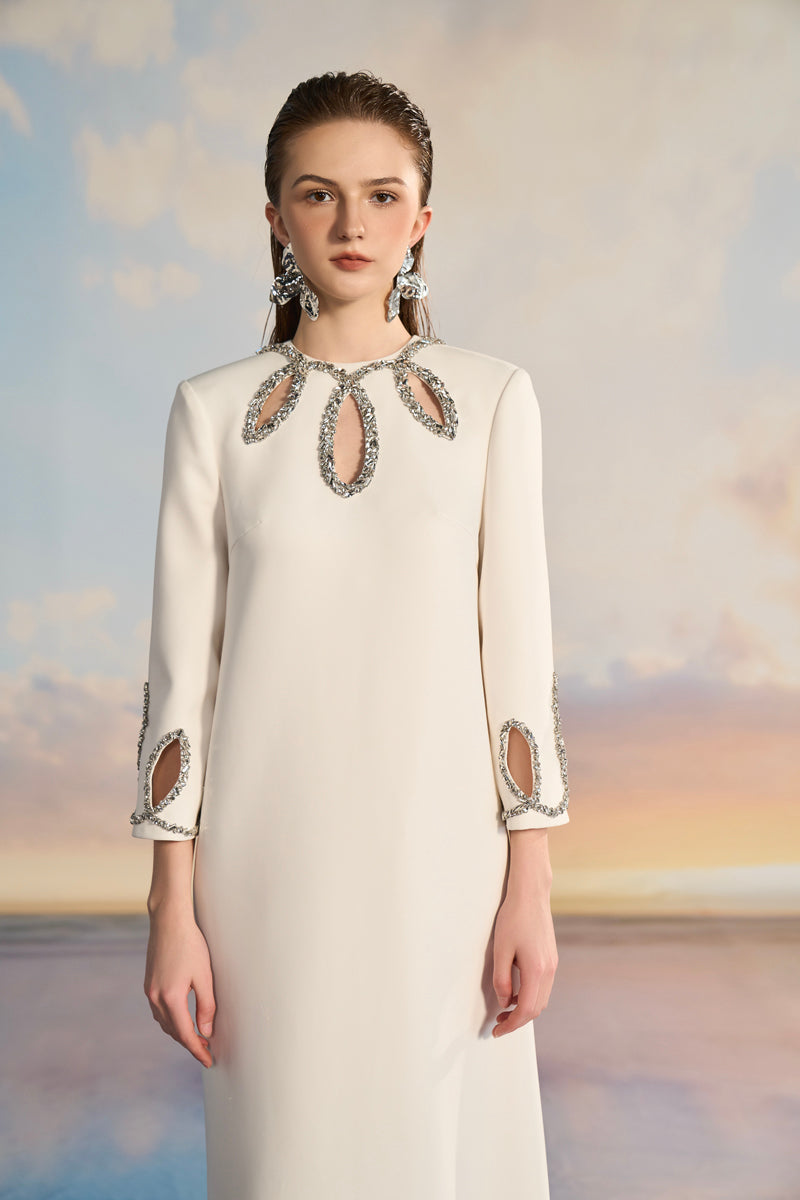 Elegant ADELA crepe cut-out gown by 21Six featuring a sleek silhouette and stylish cut-out details.