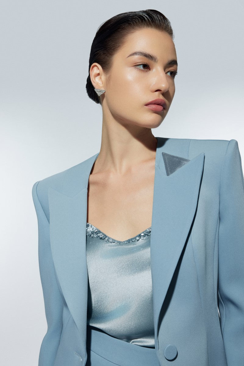 Baby blue blazer by Lekieu, Grosvenor Baby Blue Jacket, shown on a hanger with button details and tailored fit.