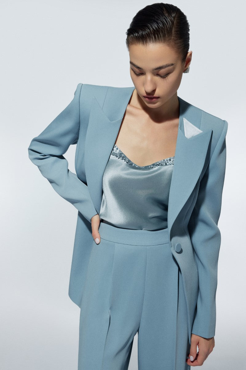 LEKIEU Grosvenor baby blue blazer for children, tailored with a classic fit and smooth fabric, displayed on a hanger.