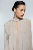 Light beige silk chiffon shirt by Lekieu, featuring a flowing design and elegant collar detail.