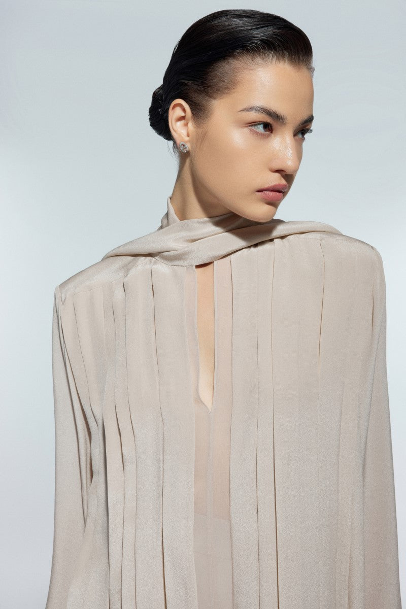 Light beige silk chiffon shirt by Lekieu, featuring a flowing design and elegant collar detail.