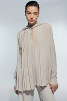 Light cream silk chiffon shirt by Lekieu, featuring a soft, flowing fabric and elegant design.