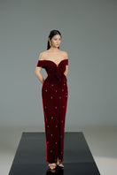 Red off-shoulder velvet floral gown by Happy Clothing, featuring a flowing design and elegant floral patterns.