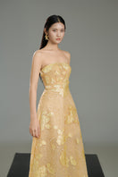 Beige strapless crystal gown by Happy Clothing featuring elegant gold accents and intricate detailing on the fabric.