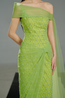 Light green crystal gown by Happy Clothing featuring intricate beadwork and flowing fabric, perfect for elegant occasions.