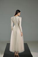 White tweed A-line gown by Happy Clothing, showcasing a stylish and elegant dress with a fitted waist and classic silhouette.