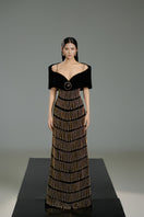 Black velvet gown with cold shoulder sleeves by Happy Clothing, featuring elegant design and a flowing silhouette.