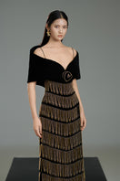 Black velvet gown with cold shoulder sleeves from Tanner Trumpet by Happy Clothing, shown on a model.