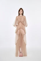 Elegant beige Sasha gown by Joséphine featuring a flowing silhouette and intricate detailing, perfect for formal occasions.