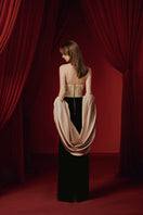 Elegant NIDALII gown by JOSÉPHINE featuring flowing fabric and intricate detailing, perfect for formal occasions.