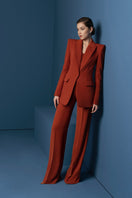 Burnt orange LEKIEU Kenya pants displayed on a model, showcasing stylish and comfortable casual trousers.