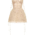 Beige floral string mini dress by Montsand, featuring a fitted silhouette and delicate floral print, perfect for warm weather.