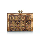 Brown Sarah's Bag backgammon clutch with geometric pattern, compact design, and stylish leather accents.
