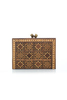 Brown Sarah's Bag backgammon clutch with geometric pattern, compact design, and stylish leather accents.