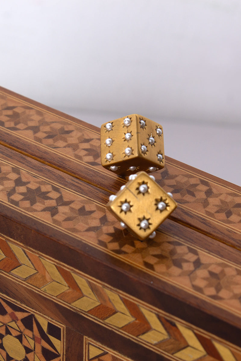 Sarah's Bag backgammon clutch with mother-of-pearl dice design in brown, featuring a stylish and functional accessory.