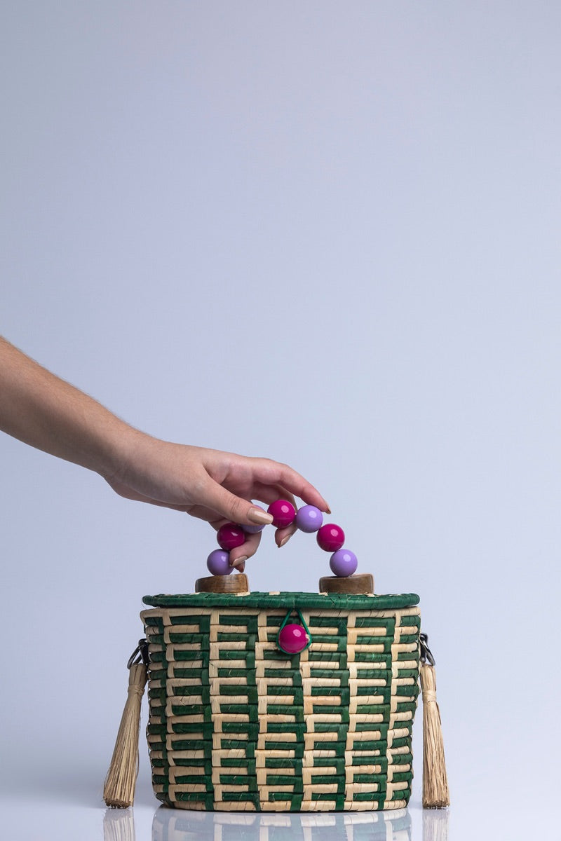 Green Catarina Mina Jirau top handle basket bag with woven design and sturdy handles, perfect for stylish everyday use.