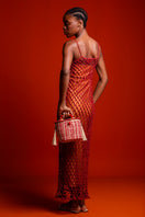 Red Catarina Mina Jirau basket tote with top handle, stylish and spacious for everyday use.