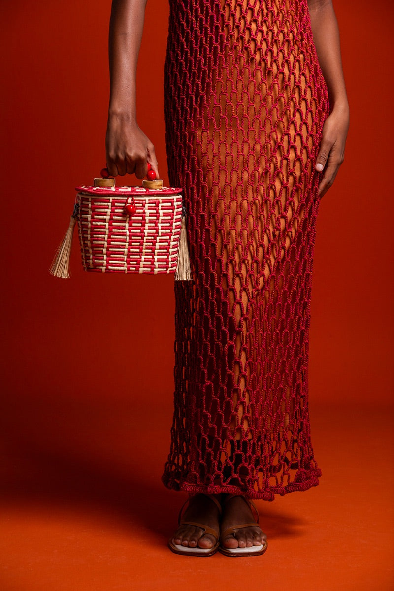 Red Catarina Mina Jirau top handle basket bag with woven design and sturdy handle, stylish accessory for daily use.