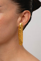 Gold baguette bold earrings by Oz Objects featuring sleek rectangular design and shiny gold finish.