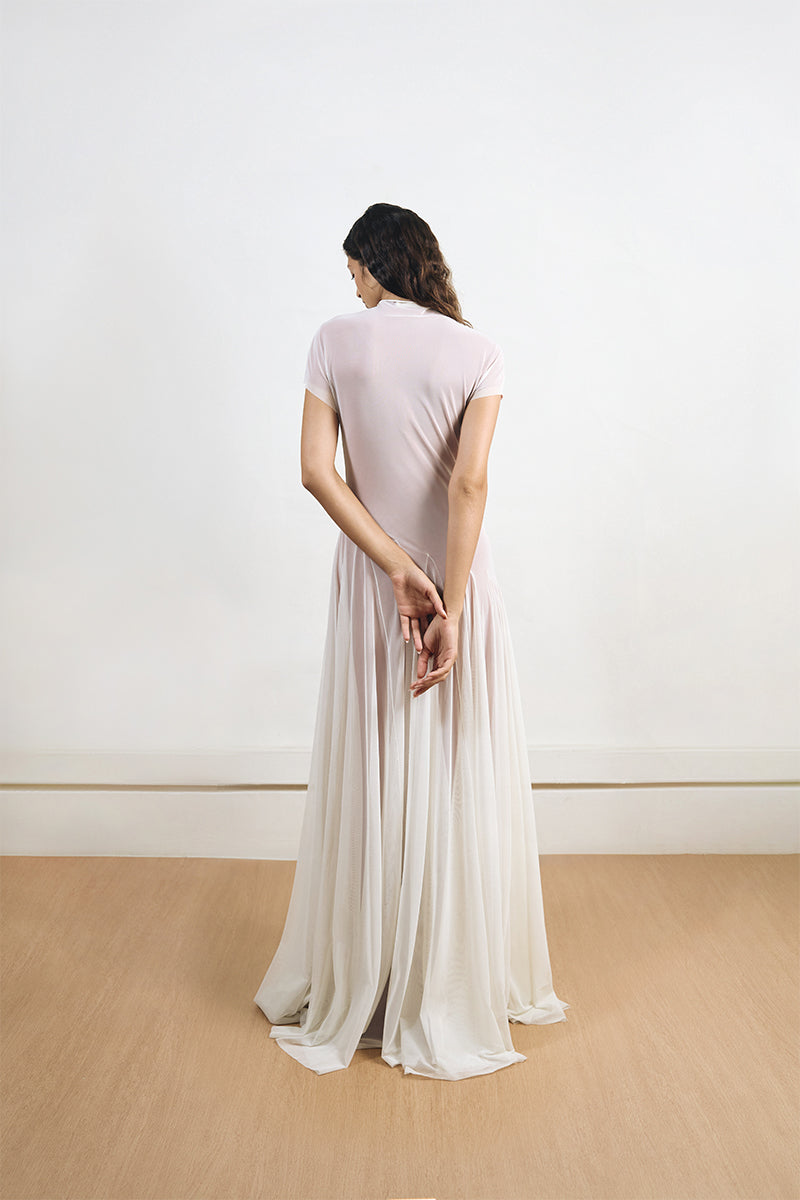 Back view of YASSMIN SALEH baklava dress in white and orange, a stylish maxi dress with intricate patterns and elegant design.
