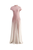 White and orange baklava-inspired maxi dress by YASSMIN SALEH, featuring flowing fabric and intricate design details.