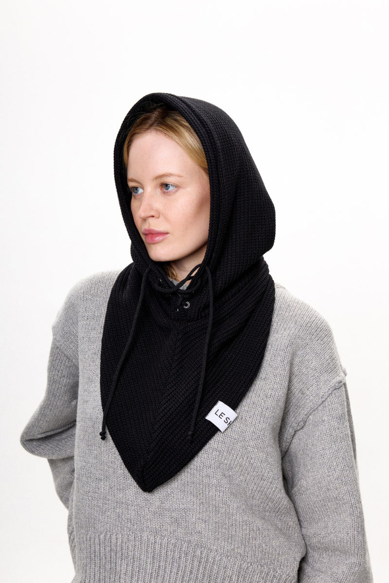 Black balaclava hat by LE SH KA, showing close-up of snug fit and breathable fabric for cold weather protection.