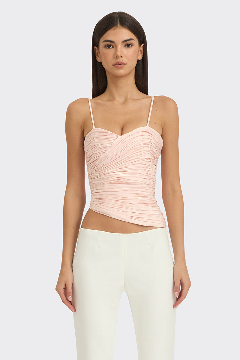 Light pink balloon-draped bustier top by Stolen Stores, featuring soft fabric and stylish design details.