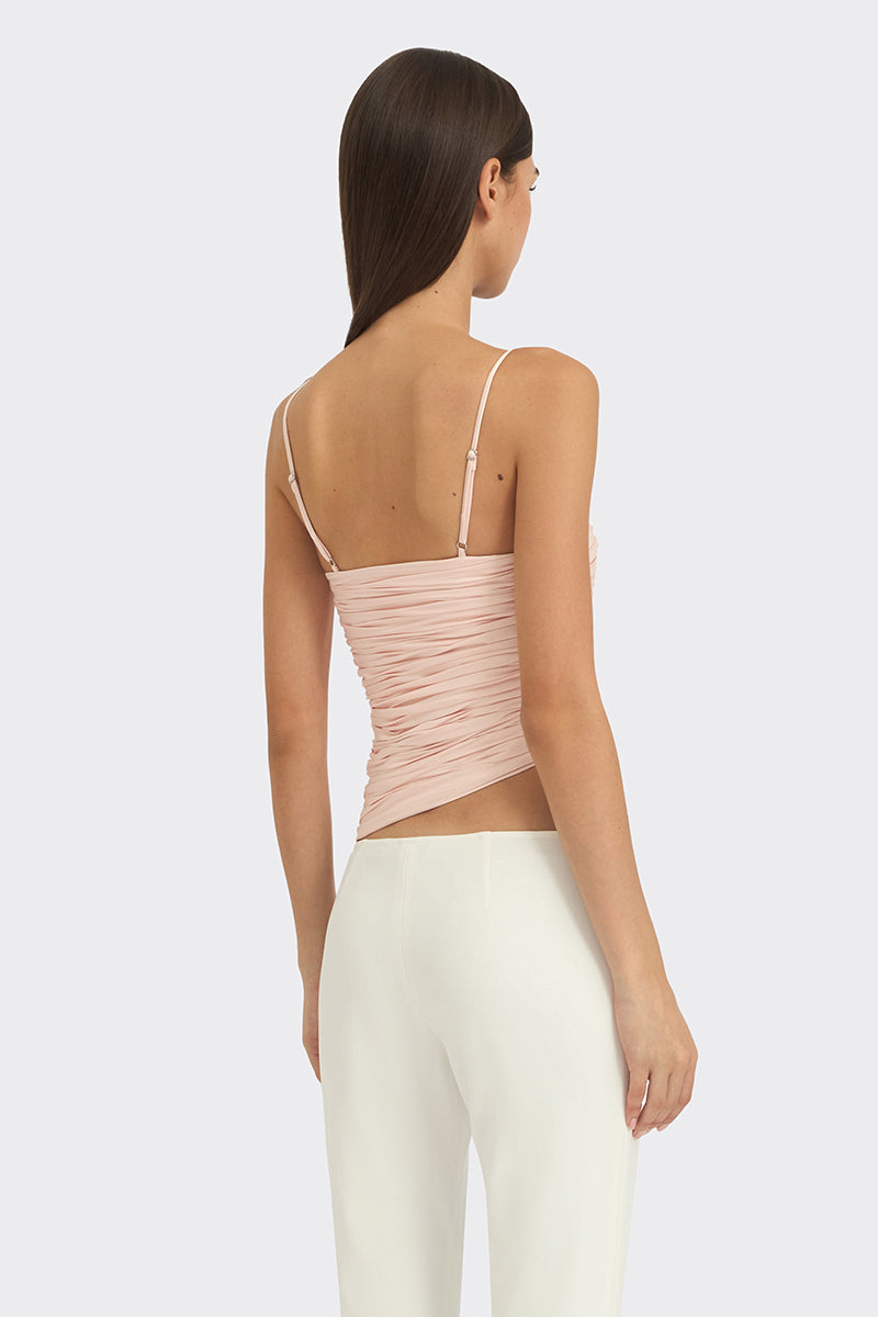 Light pink balloon-draped bustier top by Stolen Stores, featuring a fitted silhouette and stylish design.