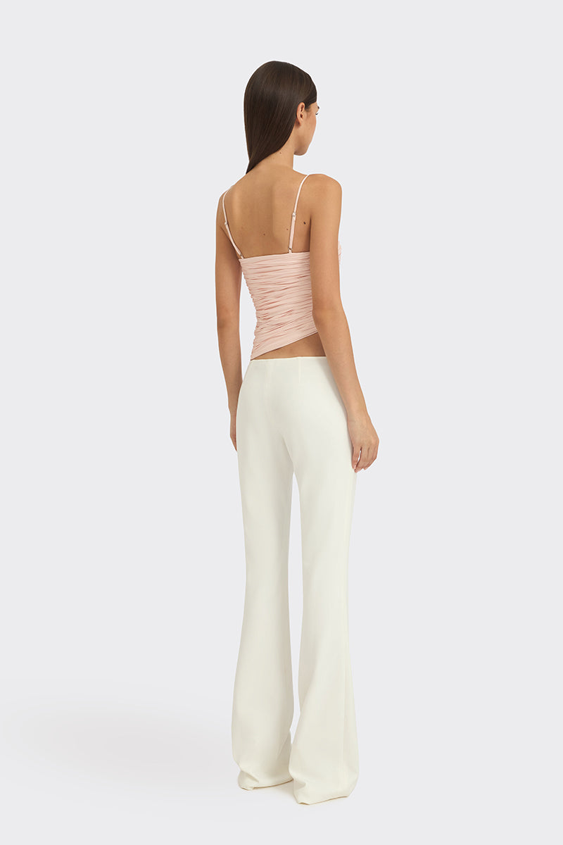 Light pink balloon draped bustier top by Stolen Stores, featuring a fitted silhouette and stylish design.