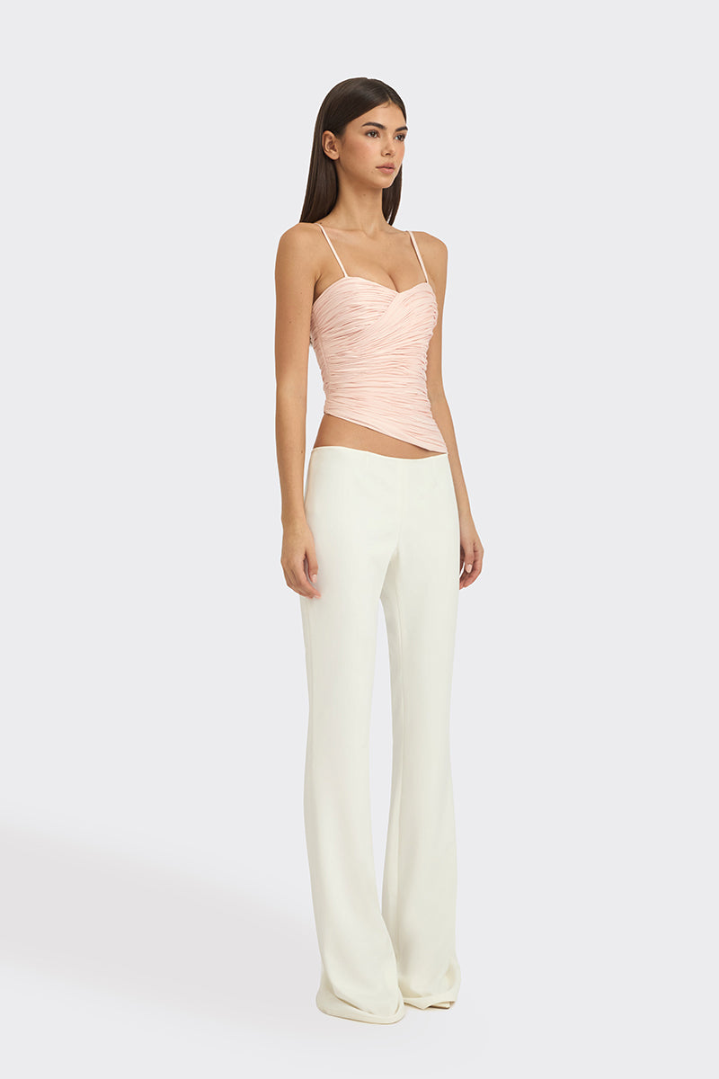 Light pink balloon-draped bustier top by Stolen Stores, featuring a fitted, stylish design with soft fabric and elegant draping.