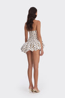 Navy blue balloon-draped polka dot mini dress from Stolen Stores, featuring a stylish and playful design for trendy occasions.