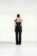Black beaded fringe tweed corset top by Tayfun Kaba featuring intricate beadwork and textured tweed fabric.