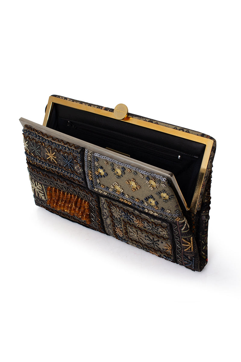 Sarah's Bag Bedouin Metallic Grace clutch featuring a shimmering metallic design and elegant compact style.