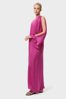 NiLuu Begonvil one-shoulder maxi dress displayed from the side, featuring a flowing silhouette and elegant design.