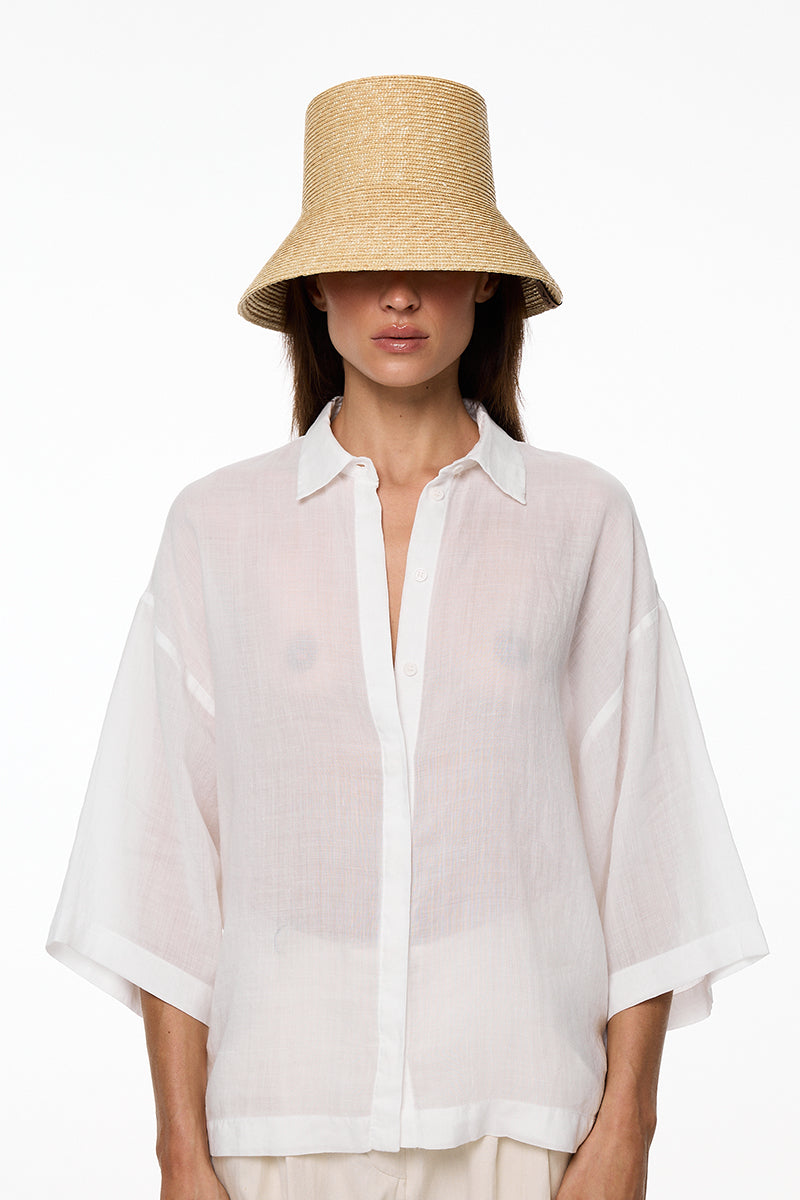 Beige bucket hat by LE SH KA featuring a wide brim and casual style, perfect for sun protection and everyday wear.